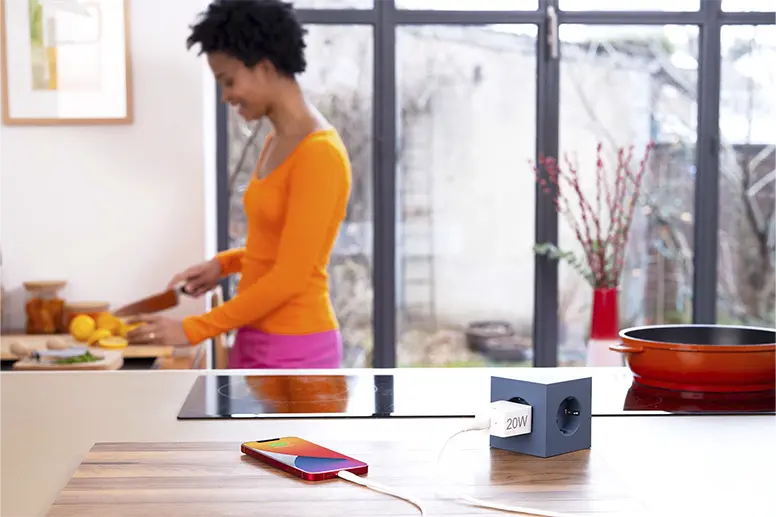 Mobile phone is being charged in the kitchen.