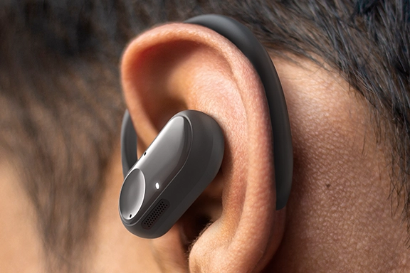 Close-up of ear with Spirit Open headphones attached.