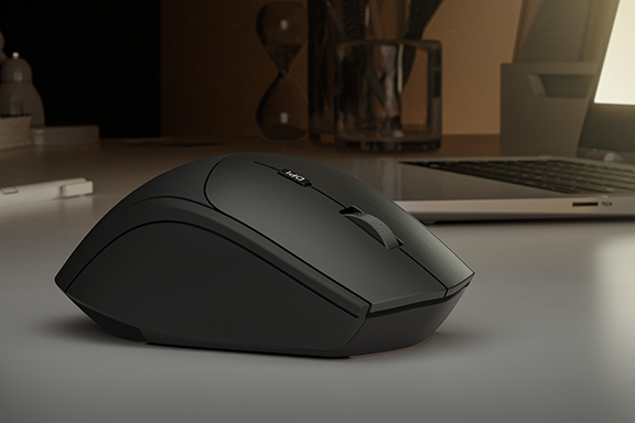 The Hama optical 6-button wireless mouse "MW-600" with dual mode with USB-C / USB-A is lying on a desk with a laptop in the background