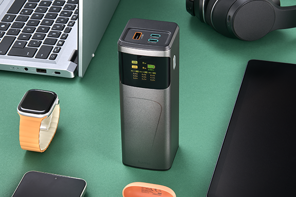 Mobile battery surrounded by many devices. It has three connections for three devices.