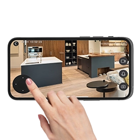 The index finger of a right hand taps on the motion control of the camera in the open Smart Home app to pan and tilt it.